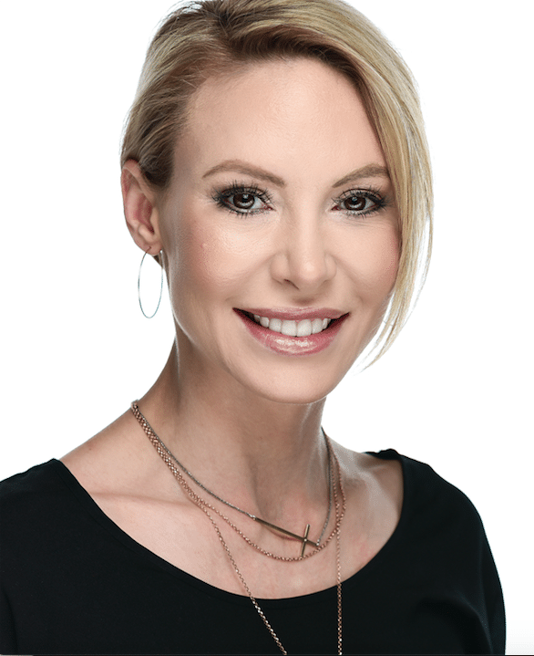 headshot of female doctor smiling with white background