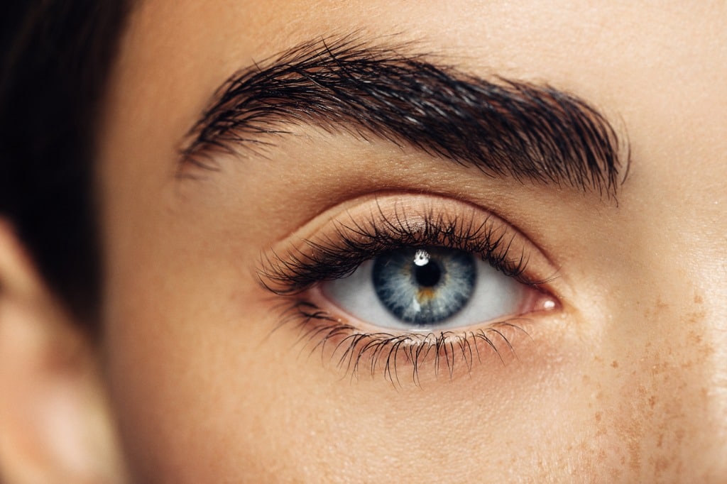 A close up image of a womand eyeball, she has blue eyes