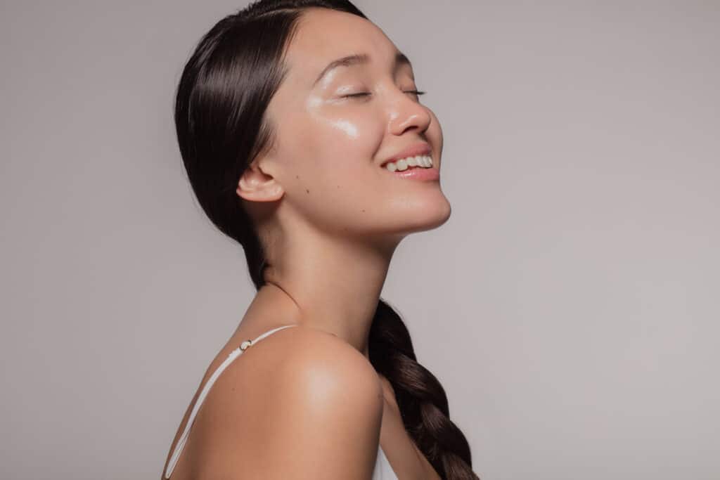 Young woman with smooth skin smiling