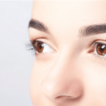 Woman with beautiful eyebrows close-up