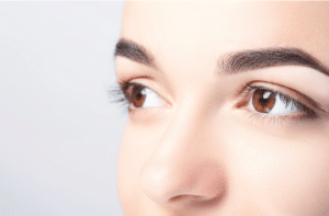 Woman with beautiful eyebrows close-up