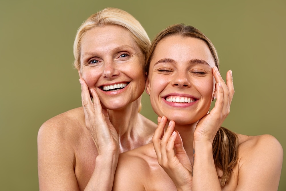 Women smiling and showing the results of fat transfer in St. Louis