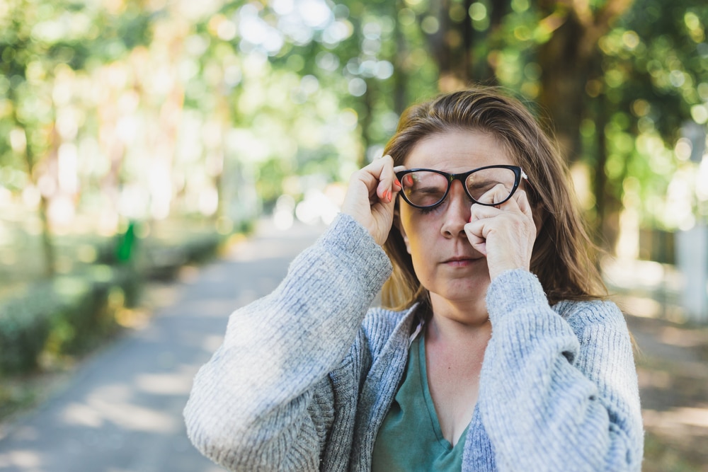 Woman with ectropion rubbing her eyes